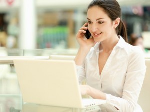 Portrait of a smiling businesswoman with phone